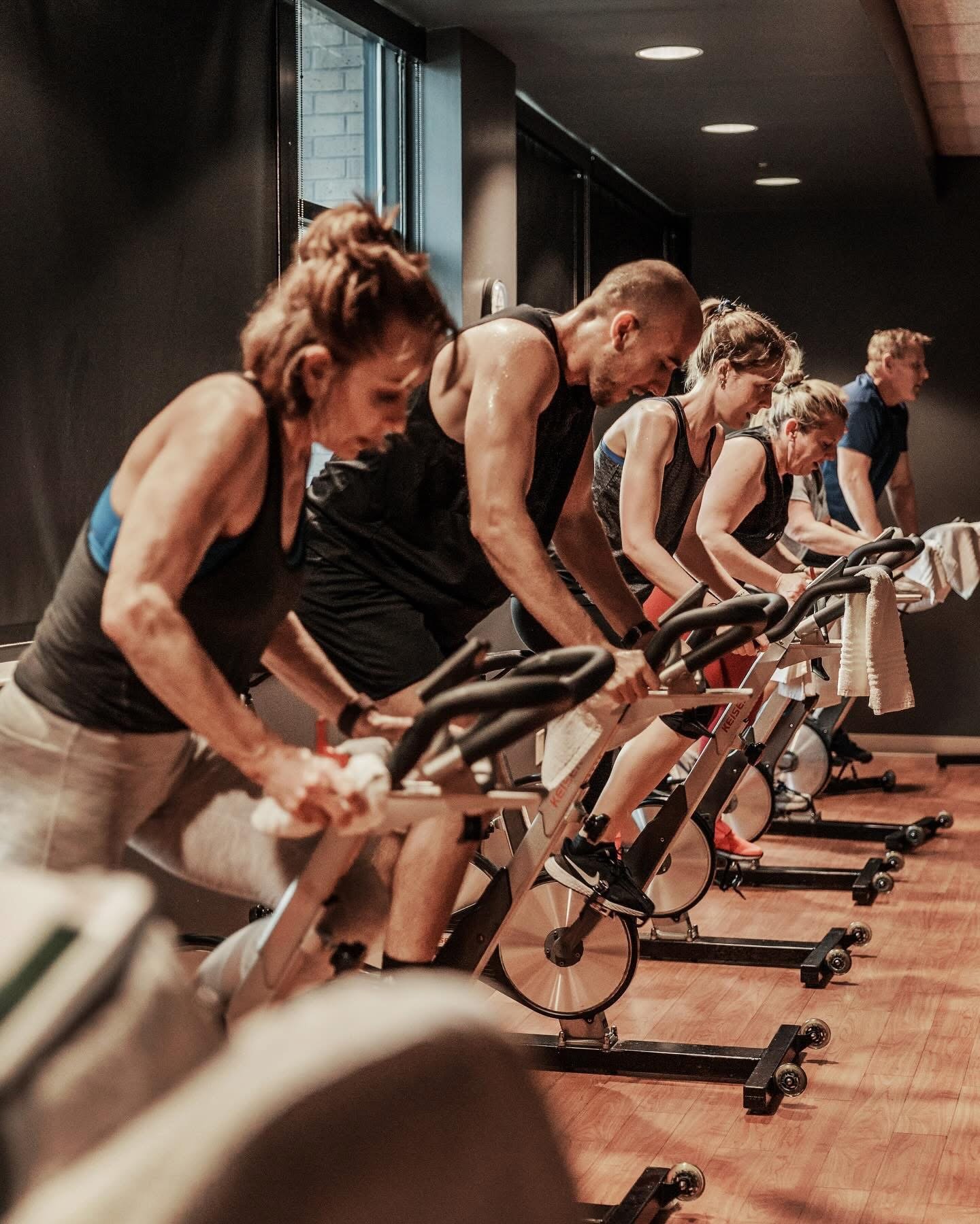 People exercising in a cycling class at Citizens HealthPlex